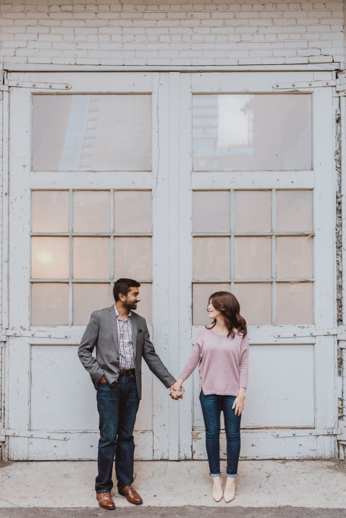 Downtown Denver Dairy Block outdoor urban fun candid loving engagement picture | From the Hip Photo Denver portrait photography 