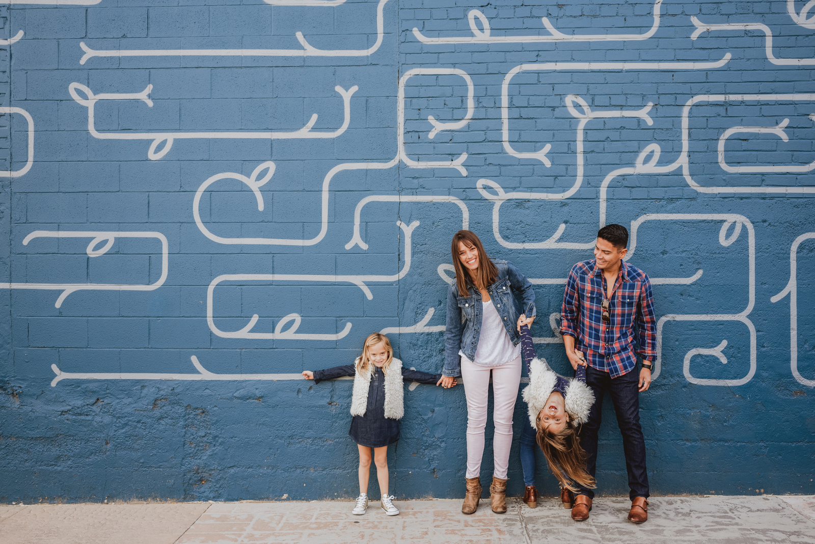 High school senior portrait session in Denver RiNo with industrial and mural backgrounds