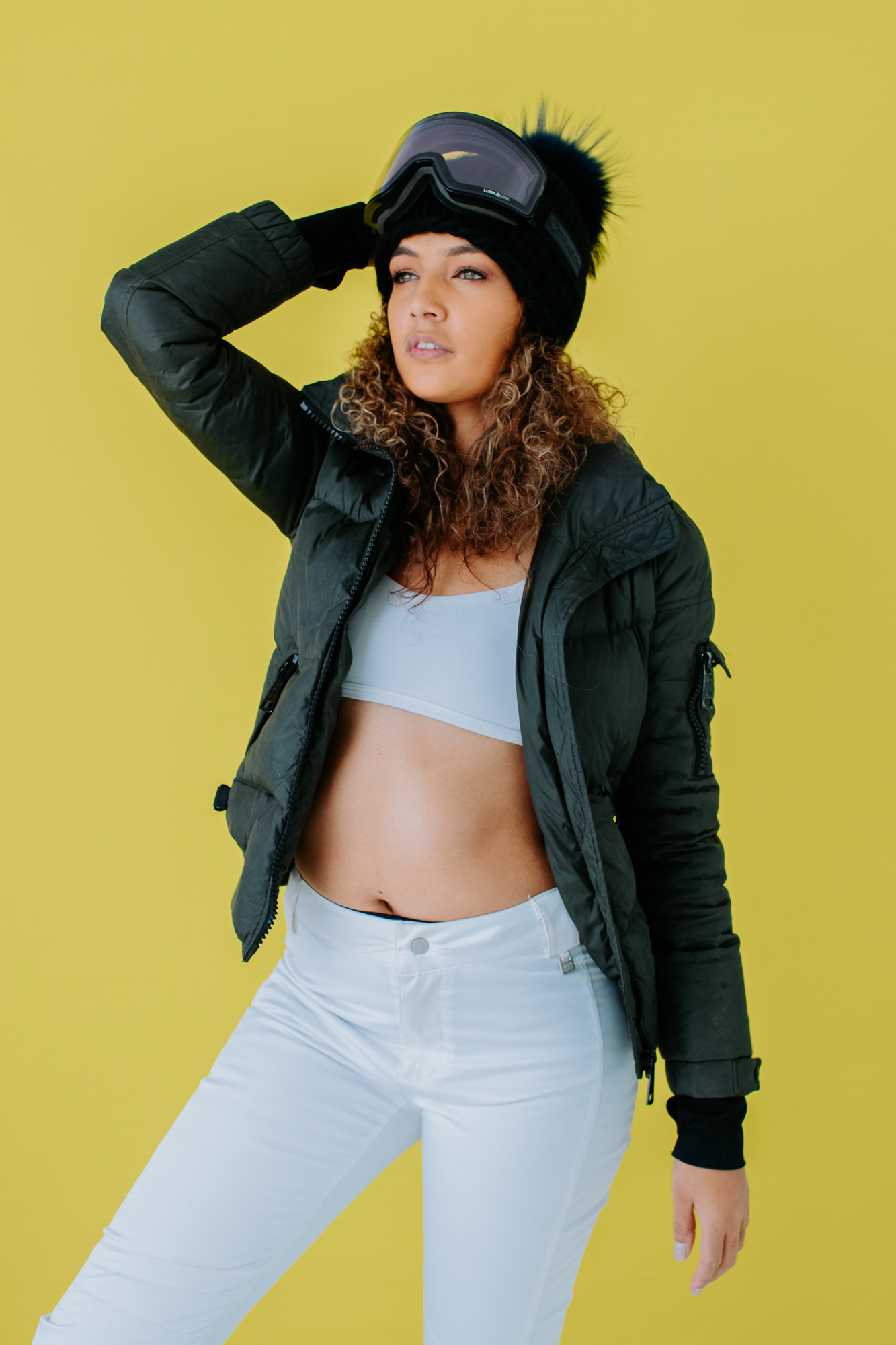 Model in Super G Brand Photography | Model wearing tank-top, winter vest and ski-goggles | Denver, Colorado