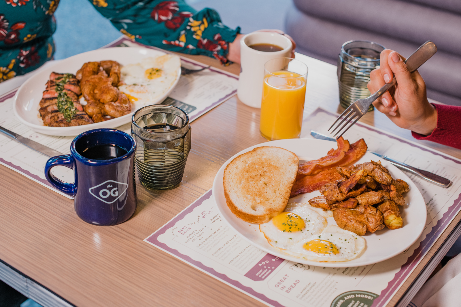 Colorado Hotel & Food Photography | The Original, The Rally Hotel | Plate of eggs, bacon and toast by glass of orange juice and mug of coffee