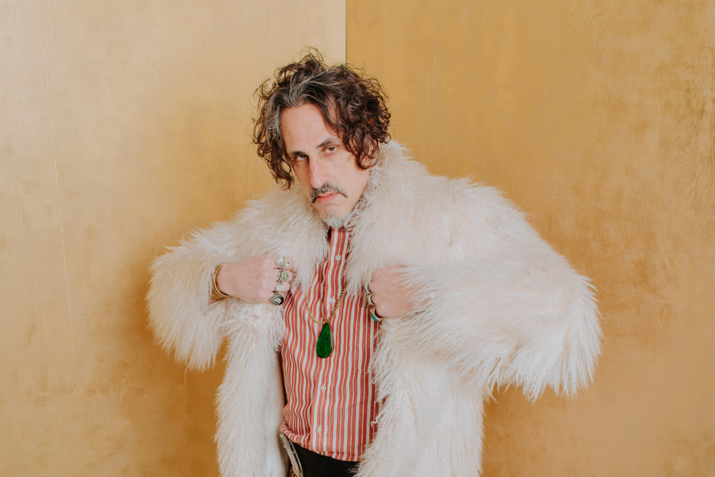 Business Photography | Spy Bar artist poses in white fluffy jacket | Event Photography | Factory Five Five 