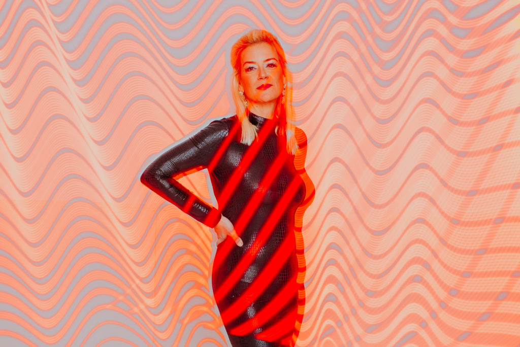 Business Photography | Spy Bar Owner poses against wavy red lighting | Portrait Photography | Factory Five Five