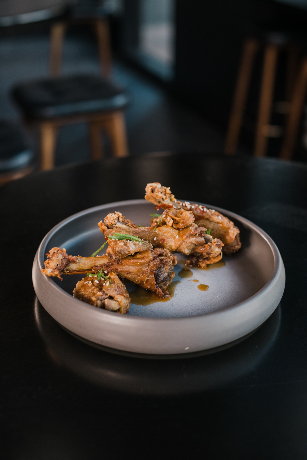 Colorado Hotel & Food Photography | The Original, The Rally Hotel | Hot wings in metallic dish on black table