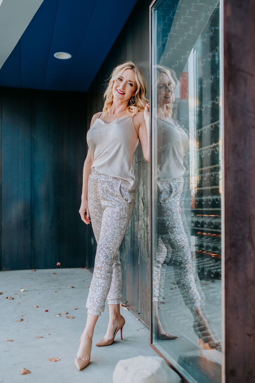 Fashion Photography | Model poses by sliding glass door | Denver, Colorado