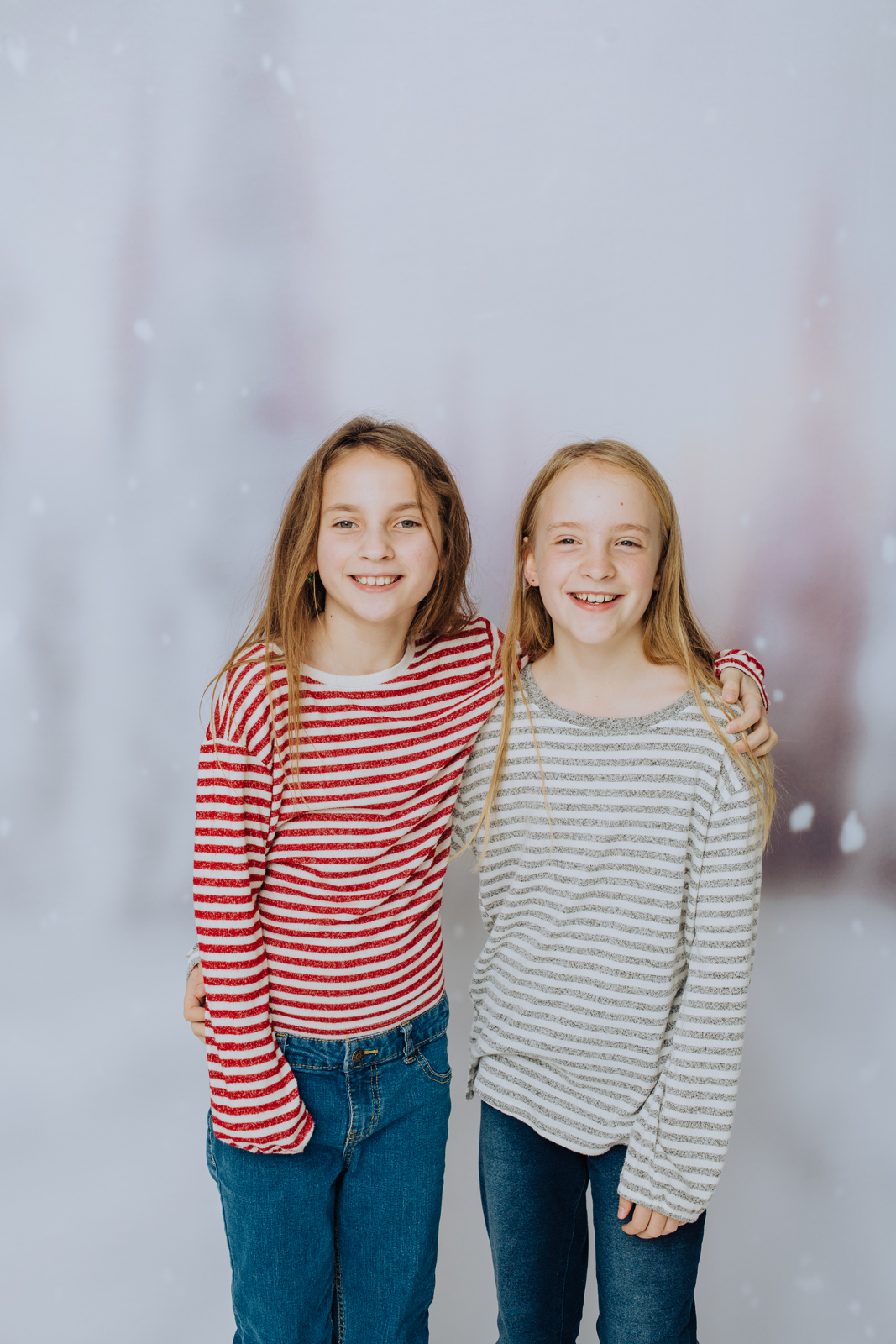 Siblings with family dog posing together for winter holiday family photography session