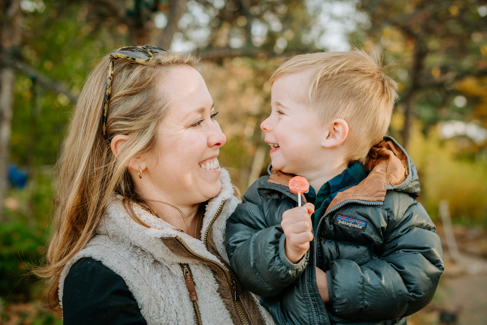 Grandparent and grandchild sharing a tender moment on a garden bench at Denver Botanic Gardens