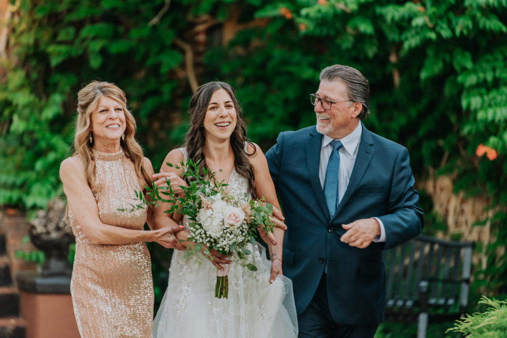From the Hip Photo captures wedding photos at Lionsgate and has some fun in the rain. 