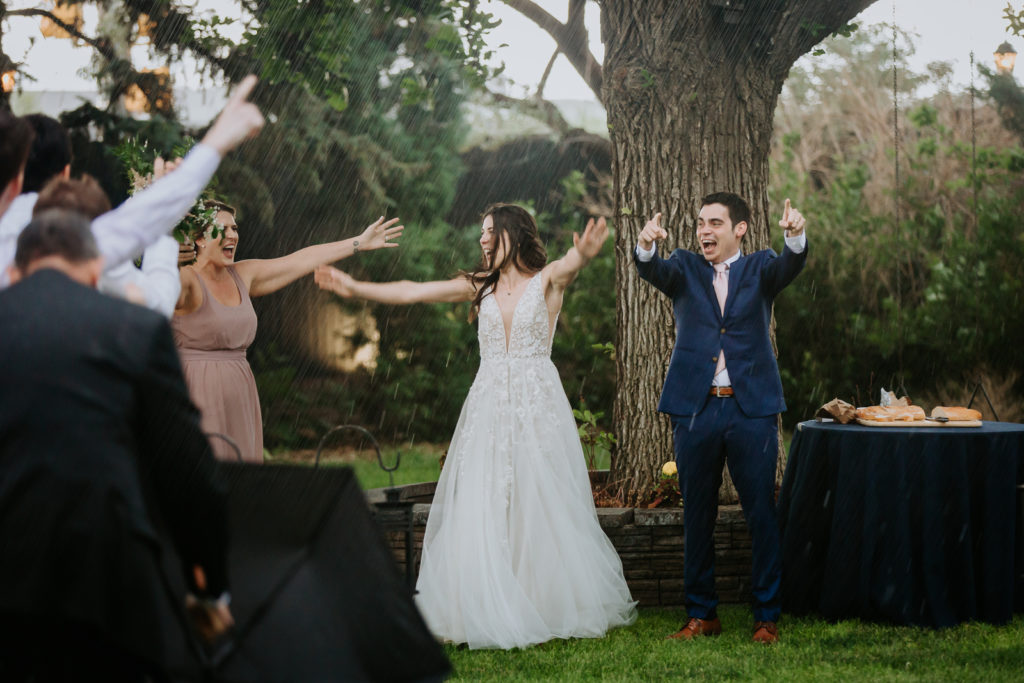 From the Hip Photo captures wedding photos at Lionsgate and has some fun in the rain. 