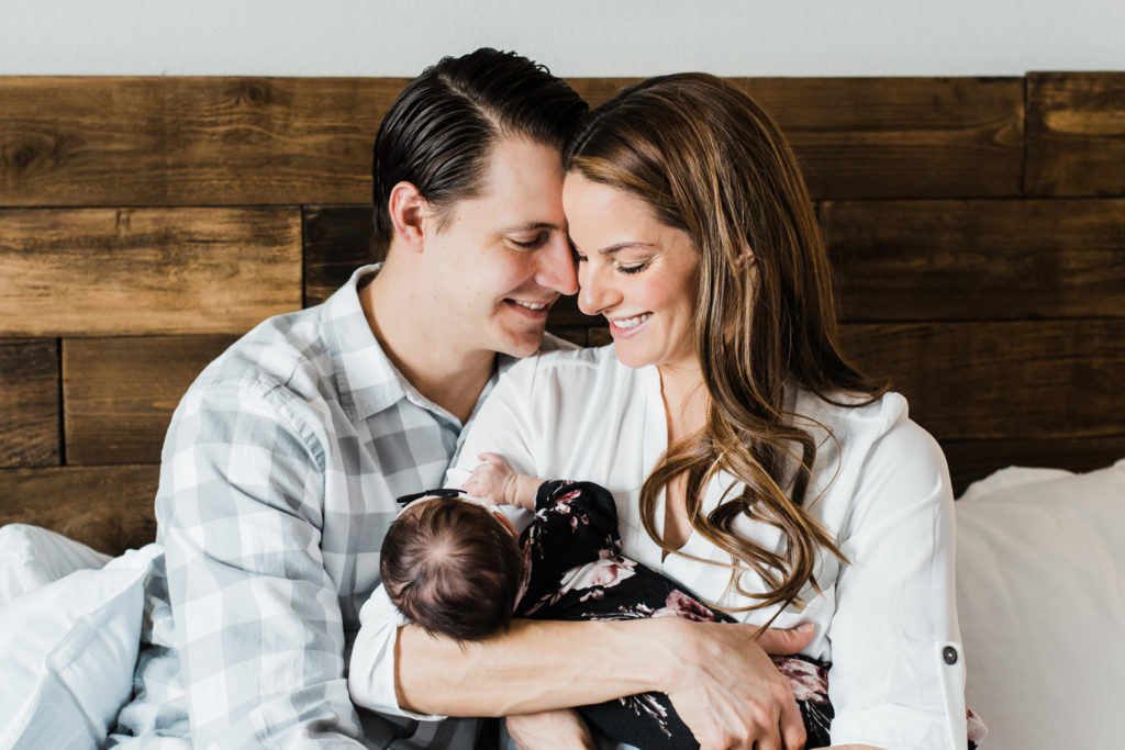 Newborn Family photography | New Parents hold their newborn