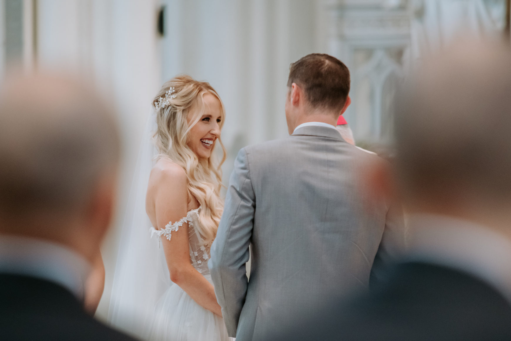 Wedding Photography | Bride smiling at groom | Cathedral Basilica of the Immaculate Conception, Denver
