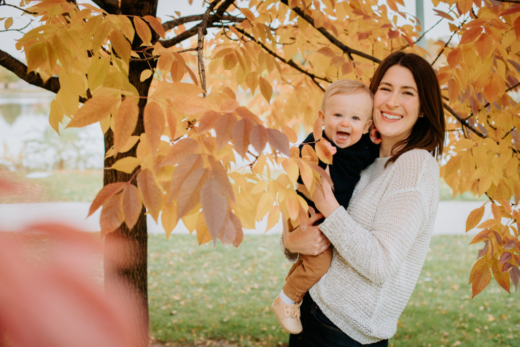 Colorado Fall Family Photo Tips | Mother and son pose in the middle of autumnal leaves