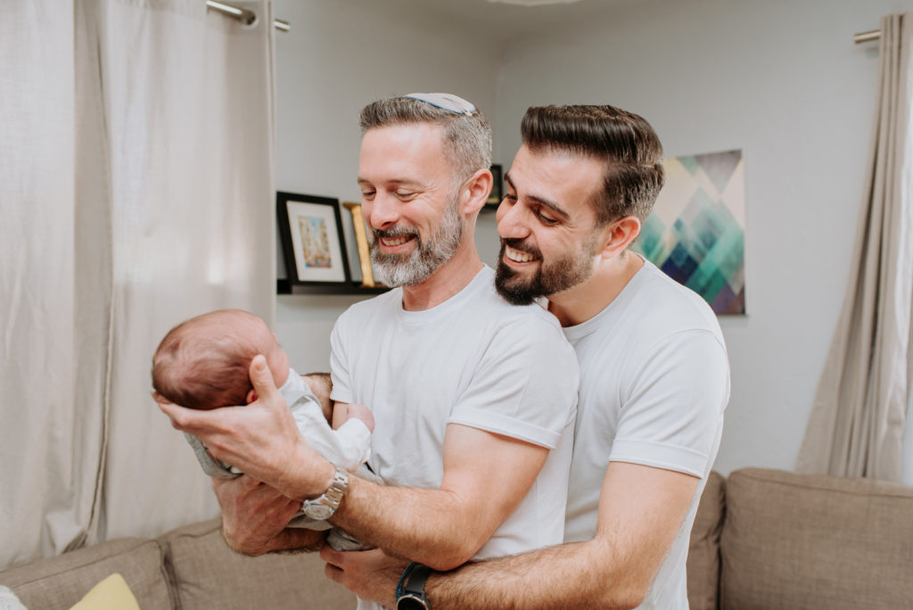 Newborn photography | New parents embrace their newborn