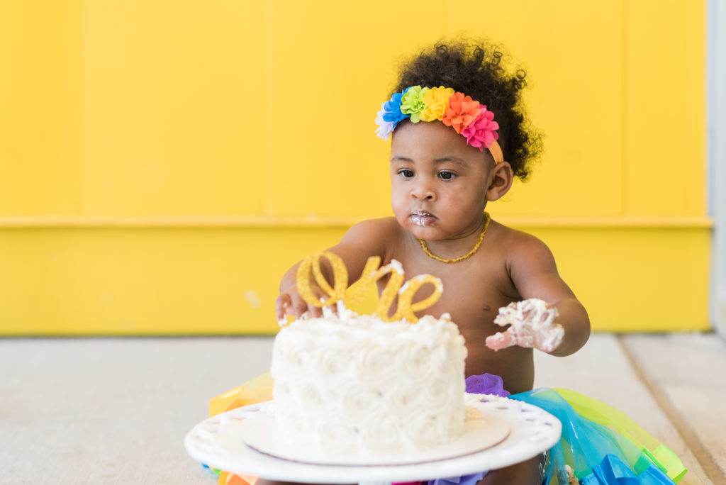 Newborn photography | First birthday cake smash with a colorful background
