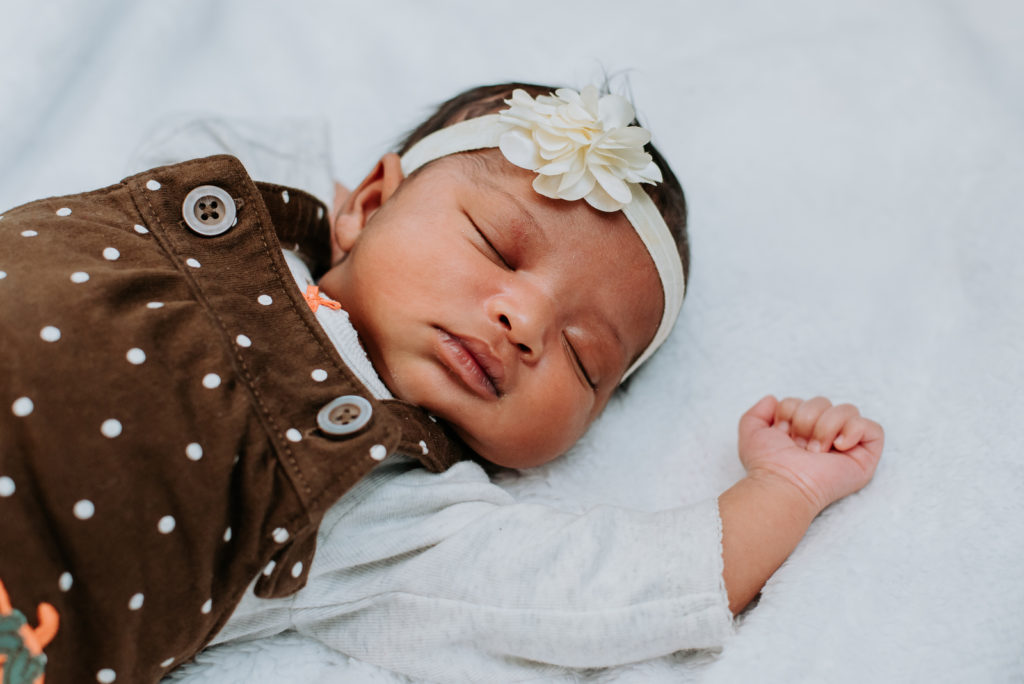 Newborn photography | Sleeping baby photo with a floral headband