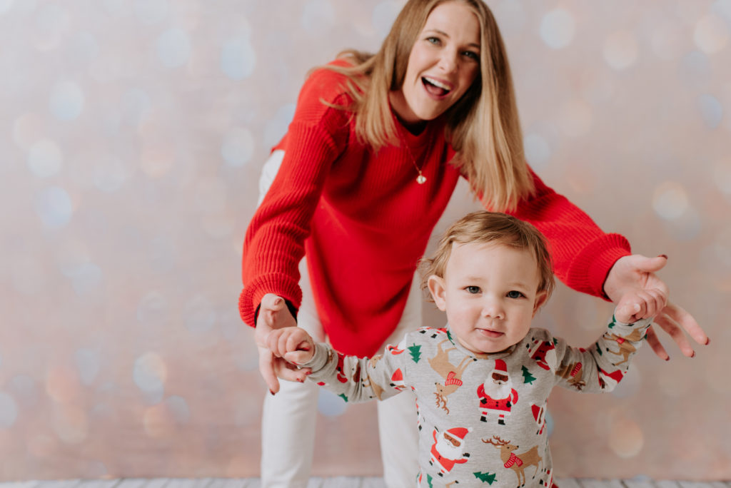 Newborn family photography | Fun Christmas photo wearing fun pijamas in the studio