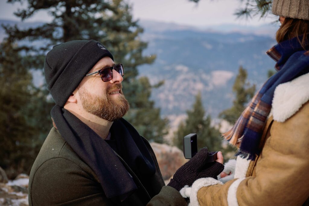 Cute couple wedding proposal in the flatirons of Boulder Colorado