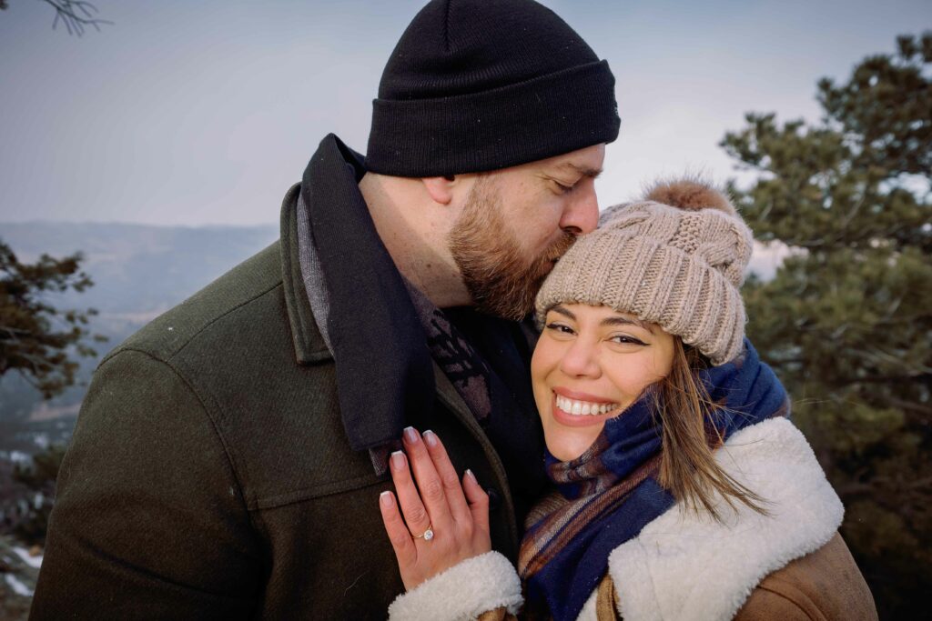 Cute couple wedding proposal in the flatirons of Boulder Colorado