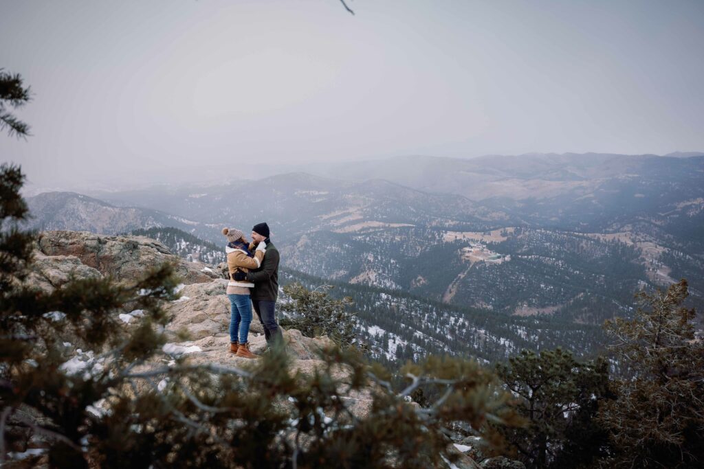 Cute couple wedding proposal in the flatirons of Boulder Colorado
