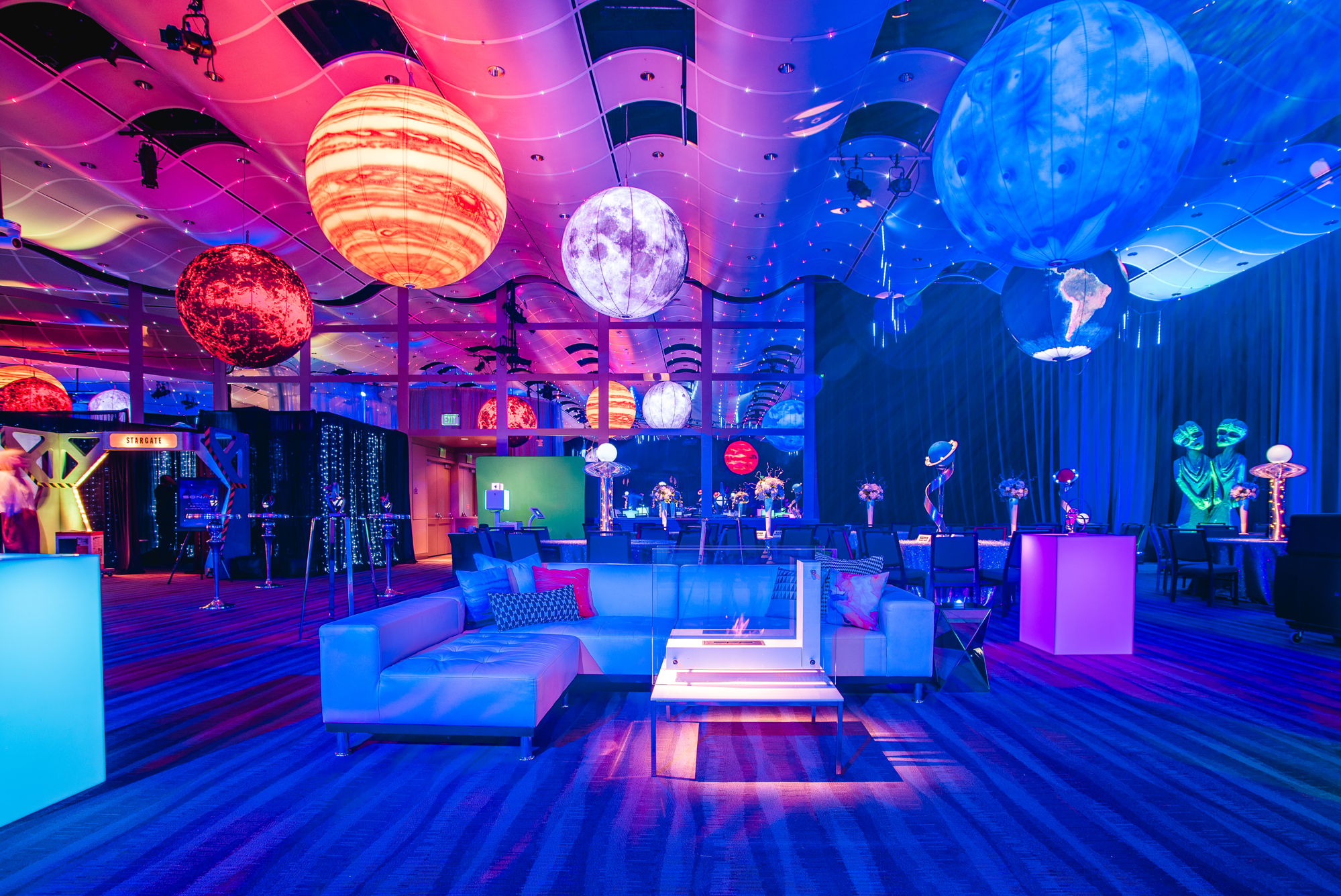 Professional event photography at a Denver corporate gathering with candid attendee interactions