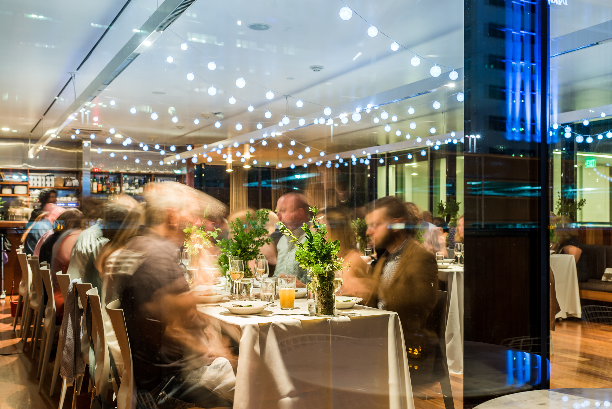 Live event photography showing speaker and audience interaction at Denver conference