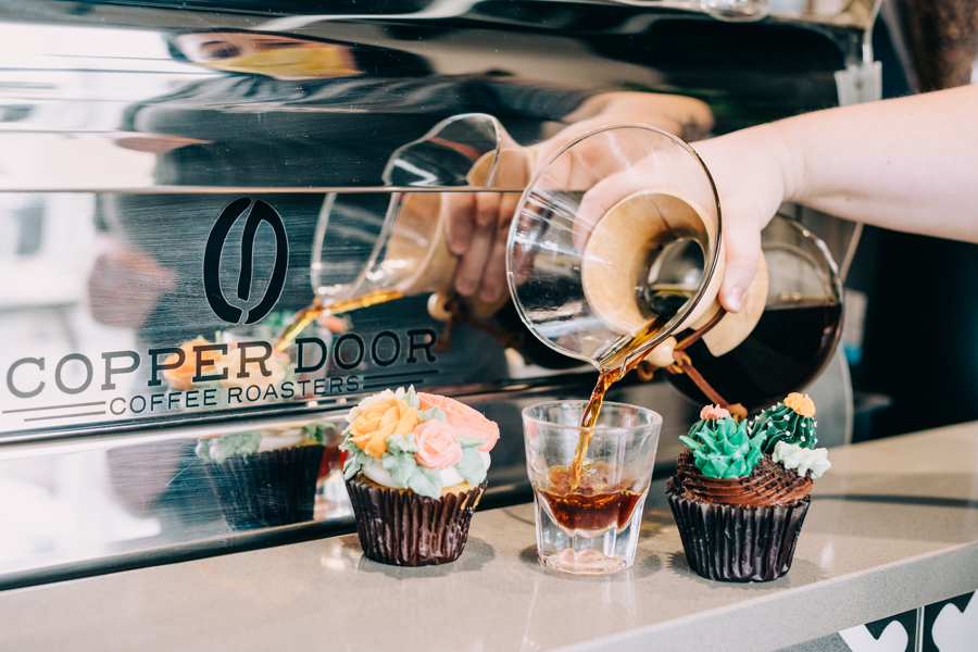 Customers enjoying specialty coffee in Denver cafe